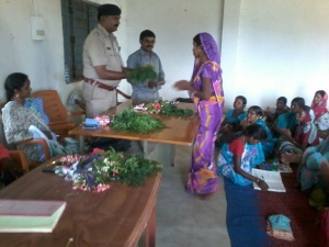 Sub-Inspector welcomed by SHG group. The flowers are from home-garden.